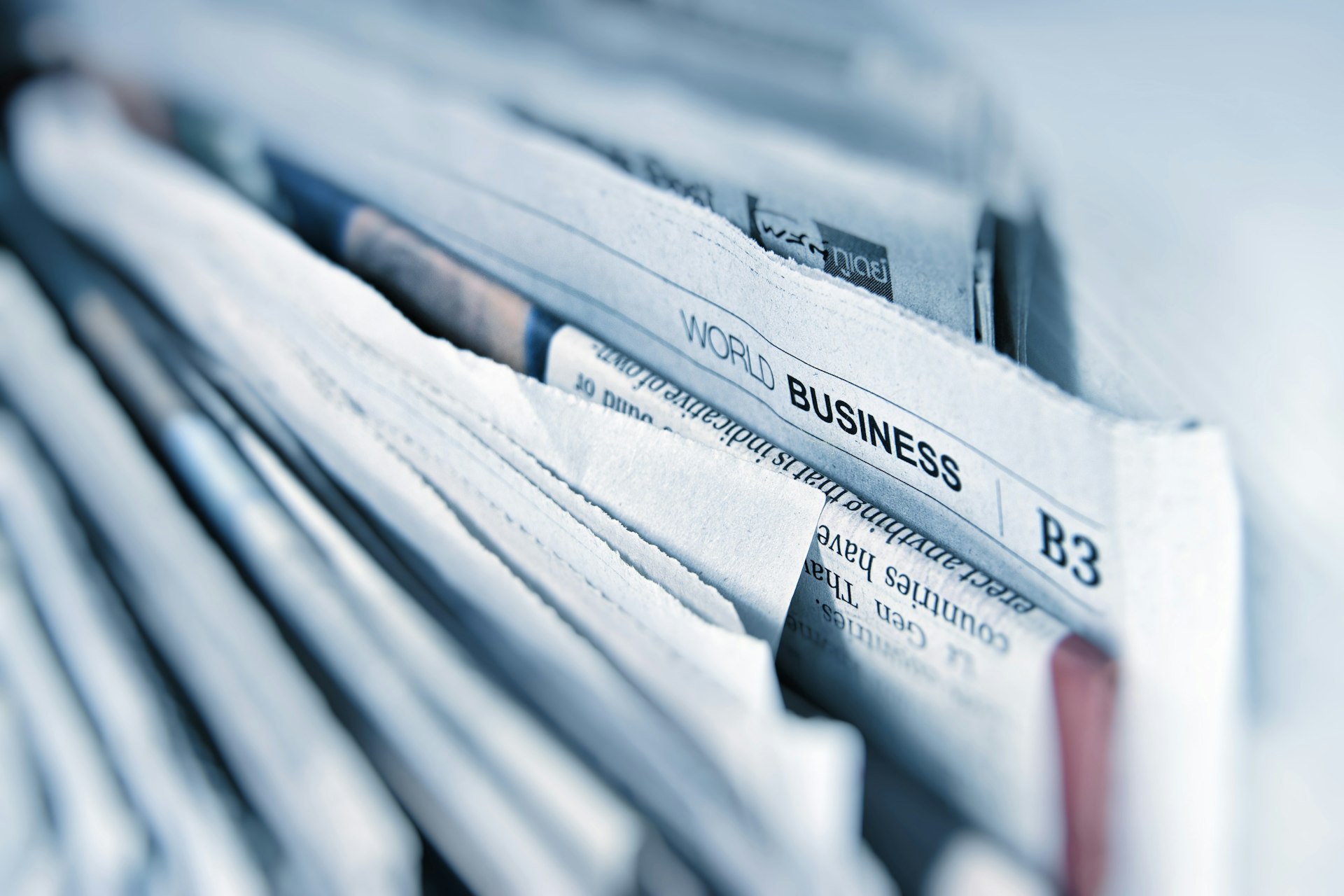 Stack of newspapers and press coverage